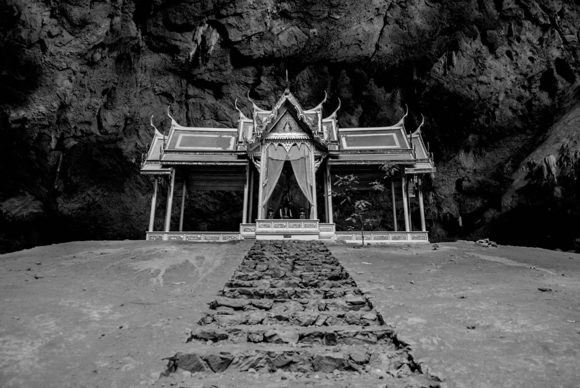 A pavilion inside a cave, reached by stone steps